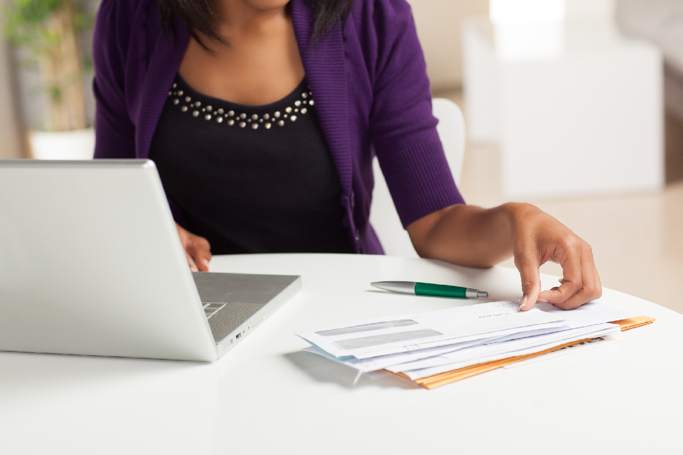 Woman at desk completing NDIS planning meeting checklist 